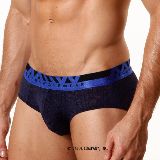 Navy carvemalewear hip brief with textured fabric and bold blue black elastic waistband featuring metromalewear logo