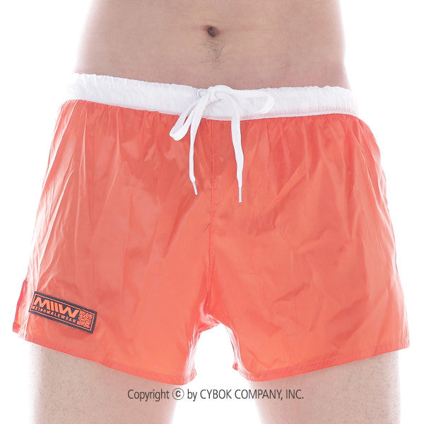 Bright orange metro male wear iron sports short with white drawstring waistband and black logo patch on left leg