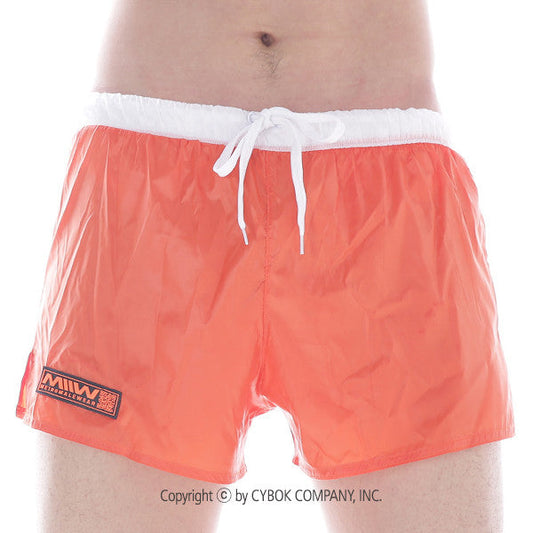 Bright orange metro male wear iron sports short with white drawstring waistband and black logo patch on left leg