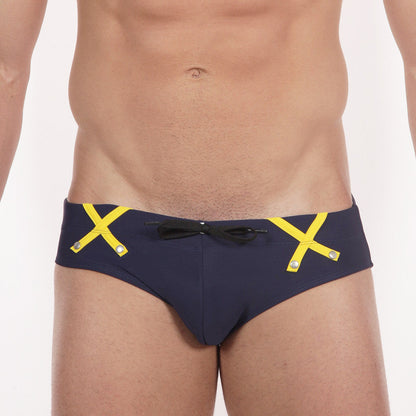 Metro malewear scottish swim brief navy 4916-83 with navy blue fabric bold yellow x straps and a black front bow