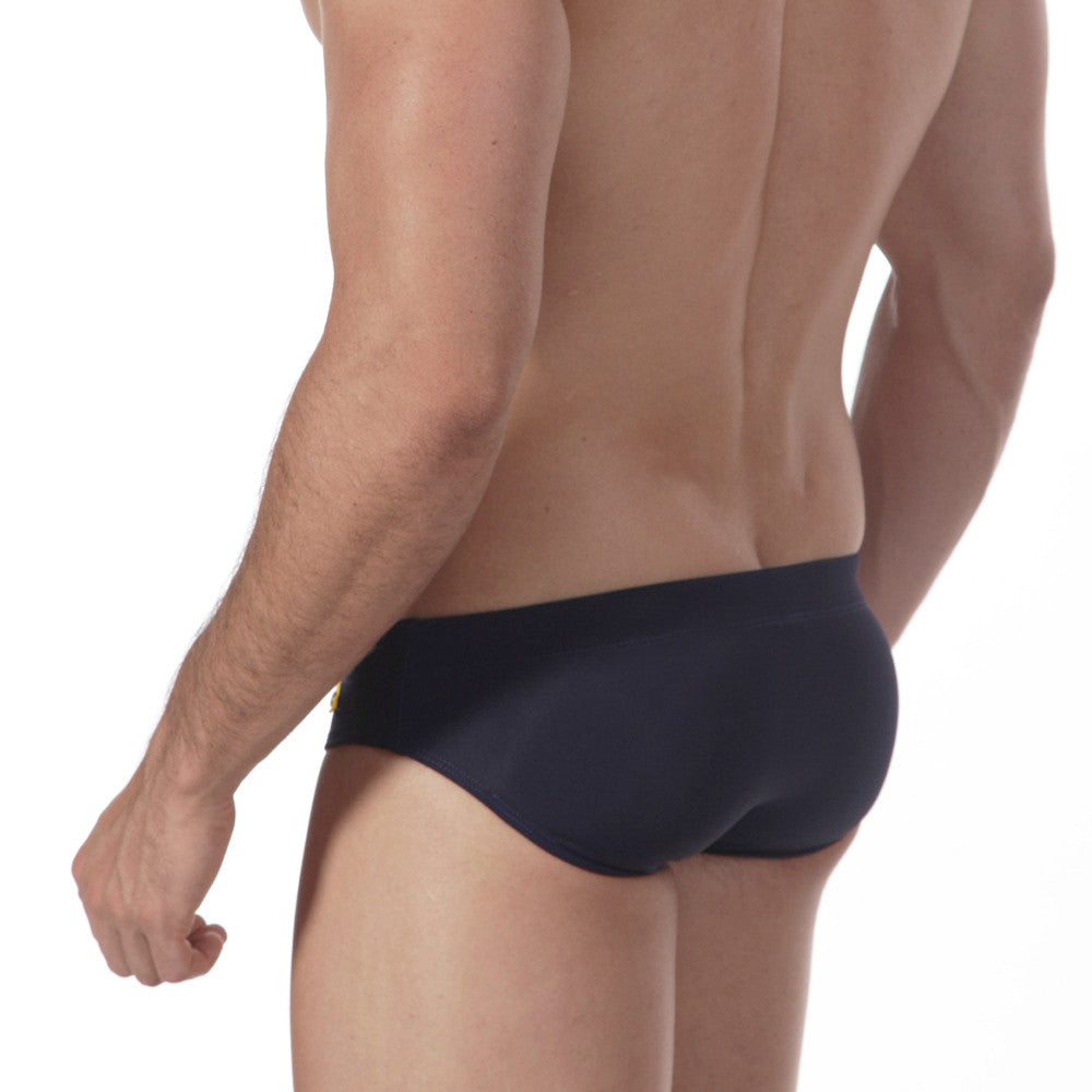 Navy blue MetroMaleWear Scottish swim brief with small gold logo on left hipband designed for swimming