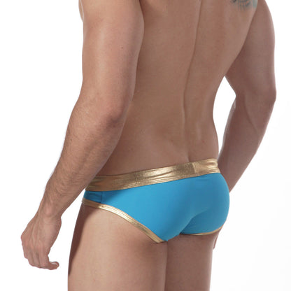 Bright blue metroMalewear empire swim brief in turquoise with a shiny gold waistband and trim for stylish swimming