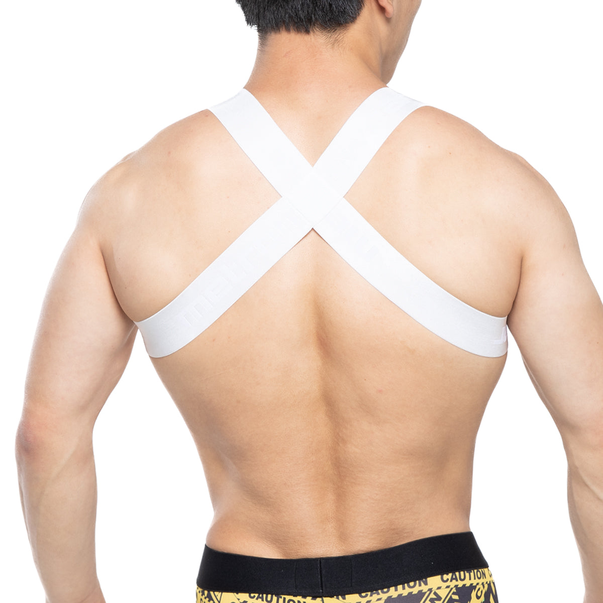 Back view of metromalewear white cross-back support strap harness tank top for shoulder support and style
