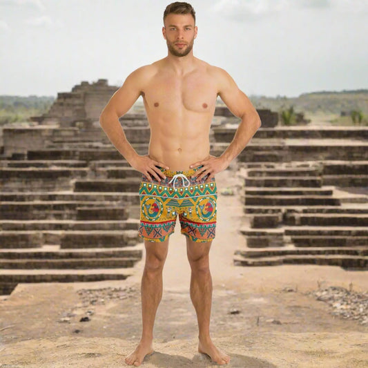 Men's swim shorts in vibrant Aztec pattern featuring a drawstring waist shown by a model by Maris Equi.