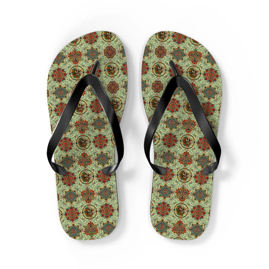 Mosaic patterned flip-flops with black straps featuring intricate floral designs by Maris Equi.