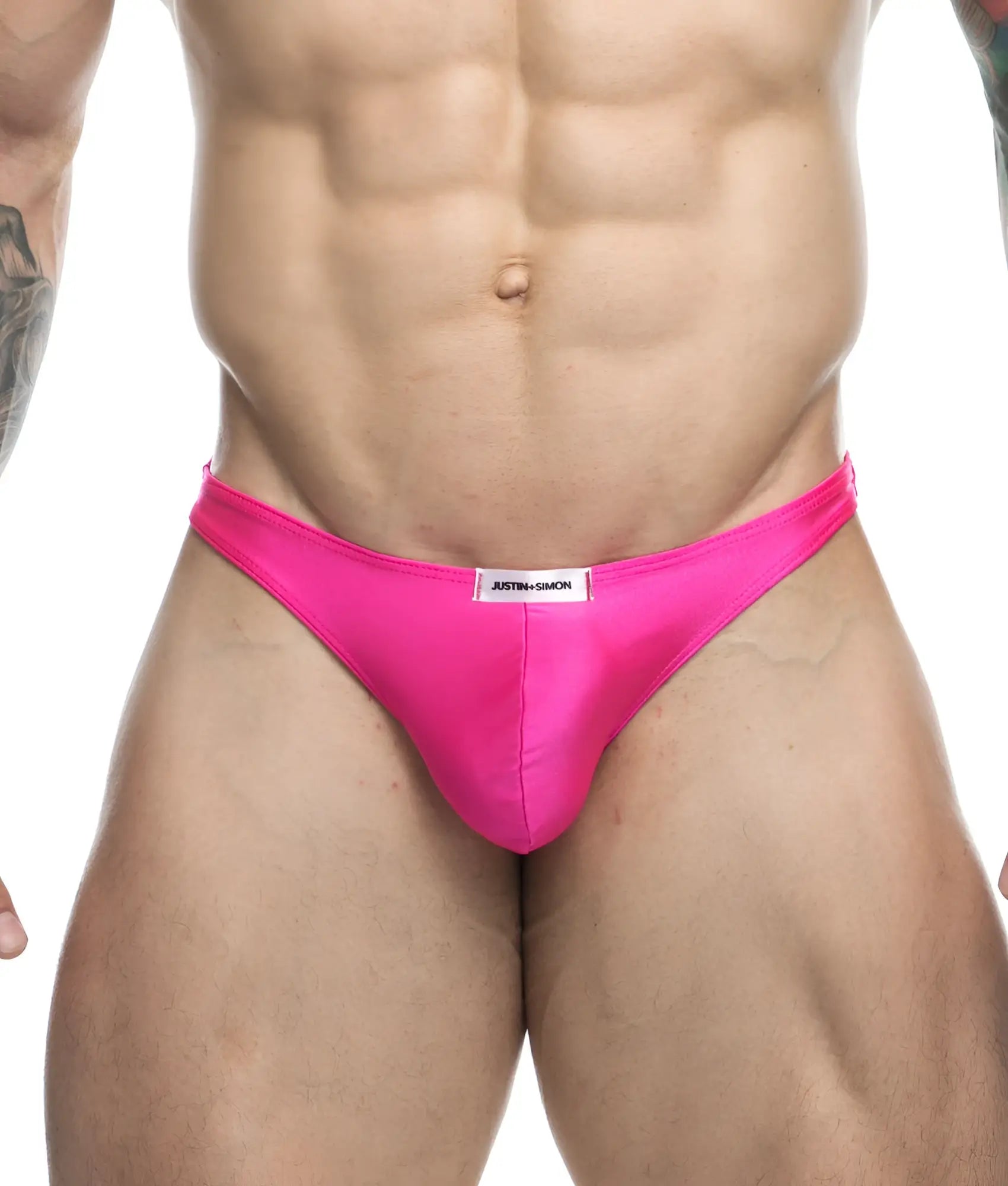 Vibrant pink satin briefs with a sleek form-fitting design and white brand label at waistband by Justin + Simon classic tanga