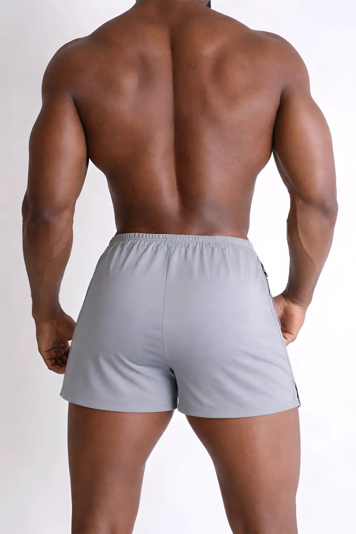 Gray 2 inch side split booty shorts with sleek modern design and subtle black side stripes in glacier grey