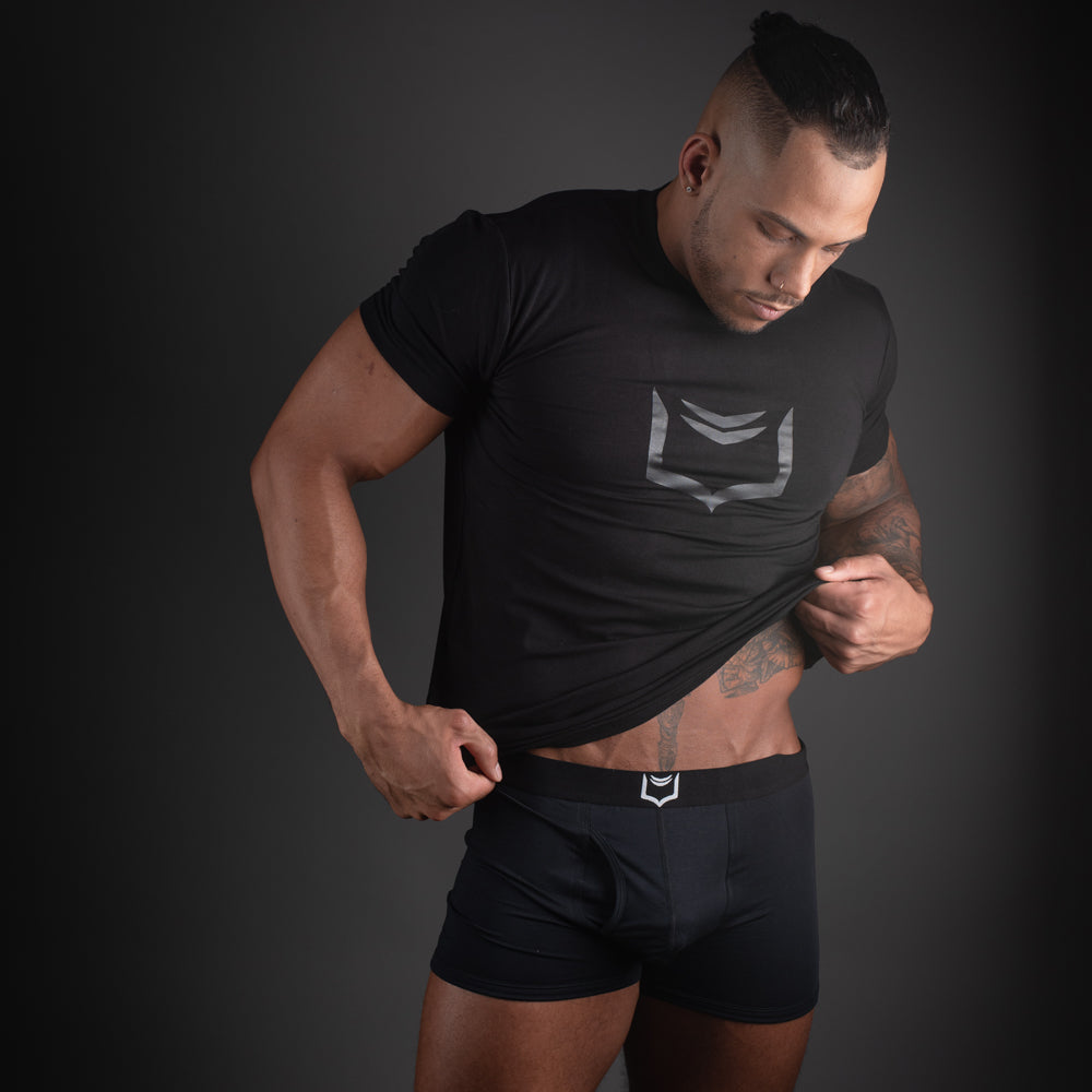 Black athletic t-shirt with silver geometric logo on chest paired with sheath 2.1 dual pouch trunks 3 pack bundle