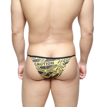 MetroMaleWear caution string bikini in black with yellow black caution tape pattern men’s briefs front view