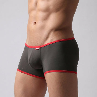 Black briefs with red trim and small red brand tag from MetroMaleWear Minimo Boxer Khaki 2013-26 product line