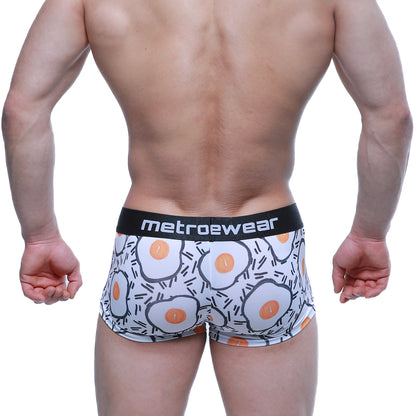 White boxer briefs with cartoon-style fried egg pattern and black waistband printed with metroewear logo, metroMaleWear Sunny Side Short Boxer 2026-68