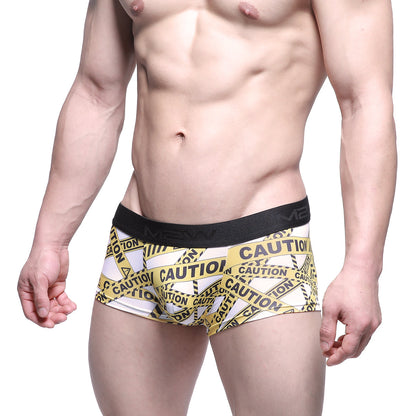 White boxer briefs with bold yellow and black caution tape pattern and black elastic waistband metroMaleWear 2026-69