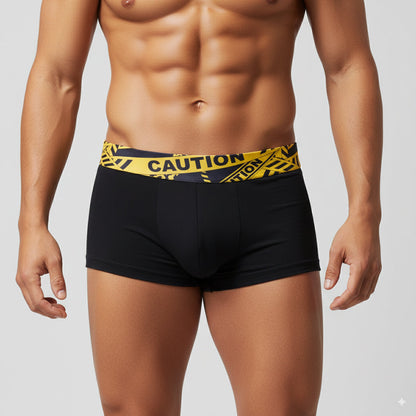 Black boxer briefs by MetroMaleWear with a bold yellow caution tape patterned waistband for everyday comfort