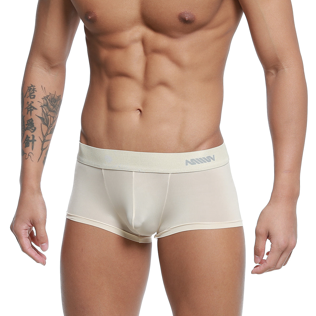 Cream-colored form-fitting men’s boxer briefs with a subtle gray logo on the waistband by metro male wear
