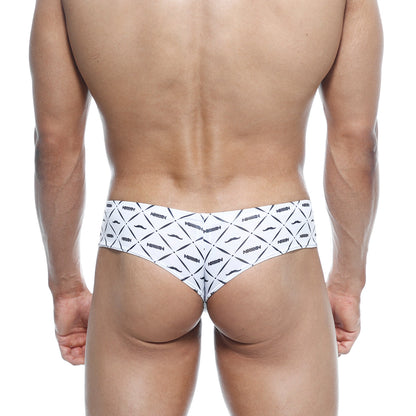 White briefs with bold black geometric and mustache pattern featuring repeated arrow branding metro malewear micro cheek caballero 2027 03