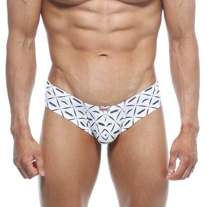 White men’s swim trunks with bold black geometric pattern and stylized mustache motifs by arrow metro male wear