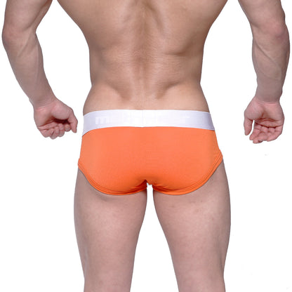 Bright orange MetroMaleWear Max Contour brief with textured fabric and white waistband featuring subtle branding