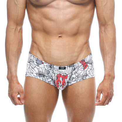 White briefs from MetroMaleWear Oscar boxer Escobar 2125-09 with bold black and red floral pattern and black waistband logo
