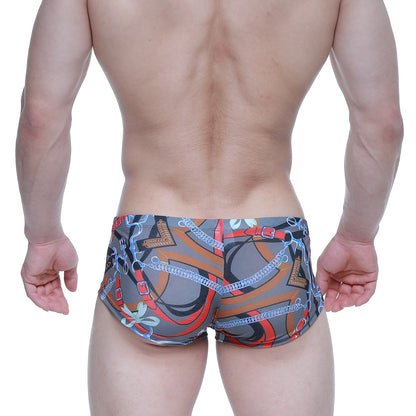 Gray MetroMaleWear Padu Trunk 2125-34 swim trunks with bold orange red and blue chain pattern and metallic accents