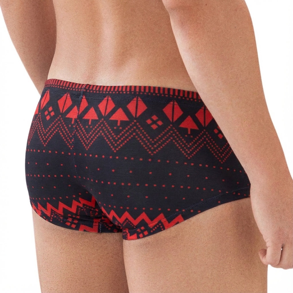 Black swim trunks by MetroMaleWear featuring a bold red geometric zigzag and triangle pattern for stylish beachwear