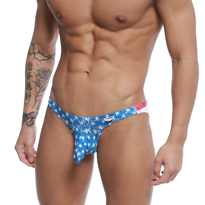 Blue star-patterned mens swim trunks with red and white waistband MetroMaleWear Cannon Hip Brief Batalla 2203-92
