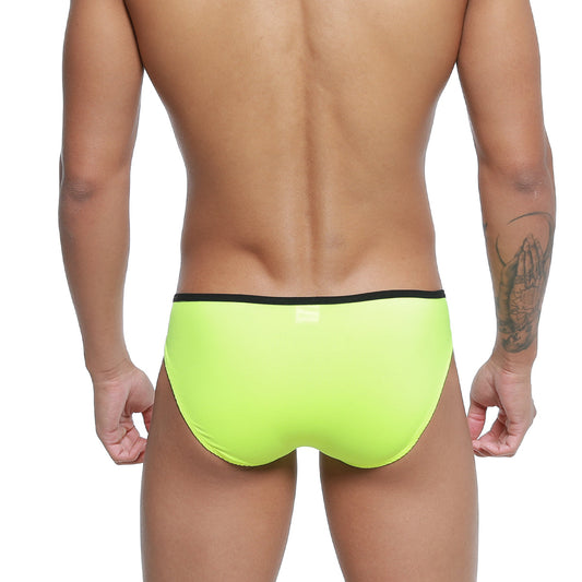 Bright neon green swim trunks with black waistband from metromalewear over-limit bikini for comfortable swimming