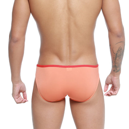 Metro malewear over-limit bikini briefs in coral with a red elastic waistband for comfortable daily wear
