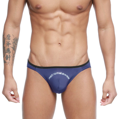 Navy blue MetroMaleWear Arc bikini briefs with black trim and white logo designed for comfortable daily wear