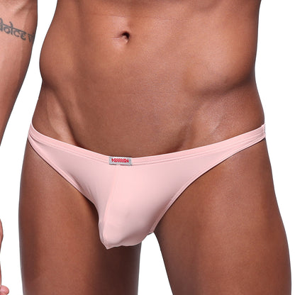 Pink mens pouch thong by metromalewear featuring a small red and white brand tag at the waistband