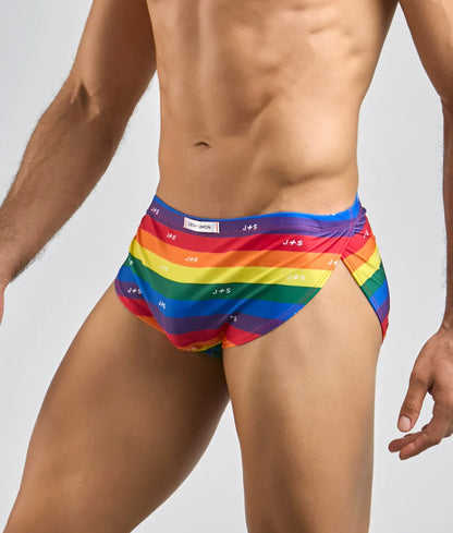 Justin and simon running short men’s swim trunks with rainbow stripes and repeating brand logo in vibrant colors