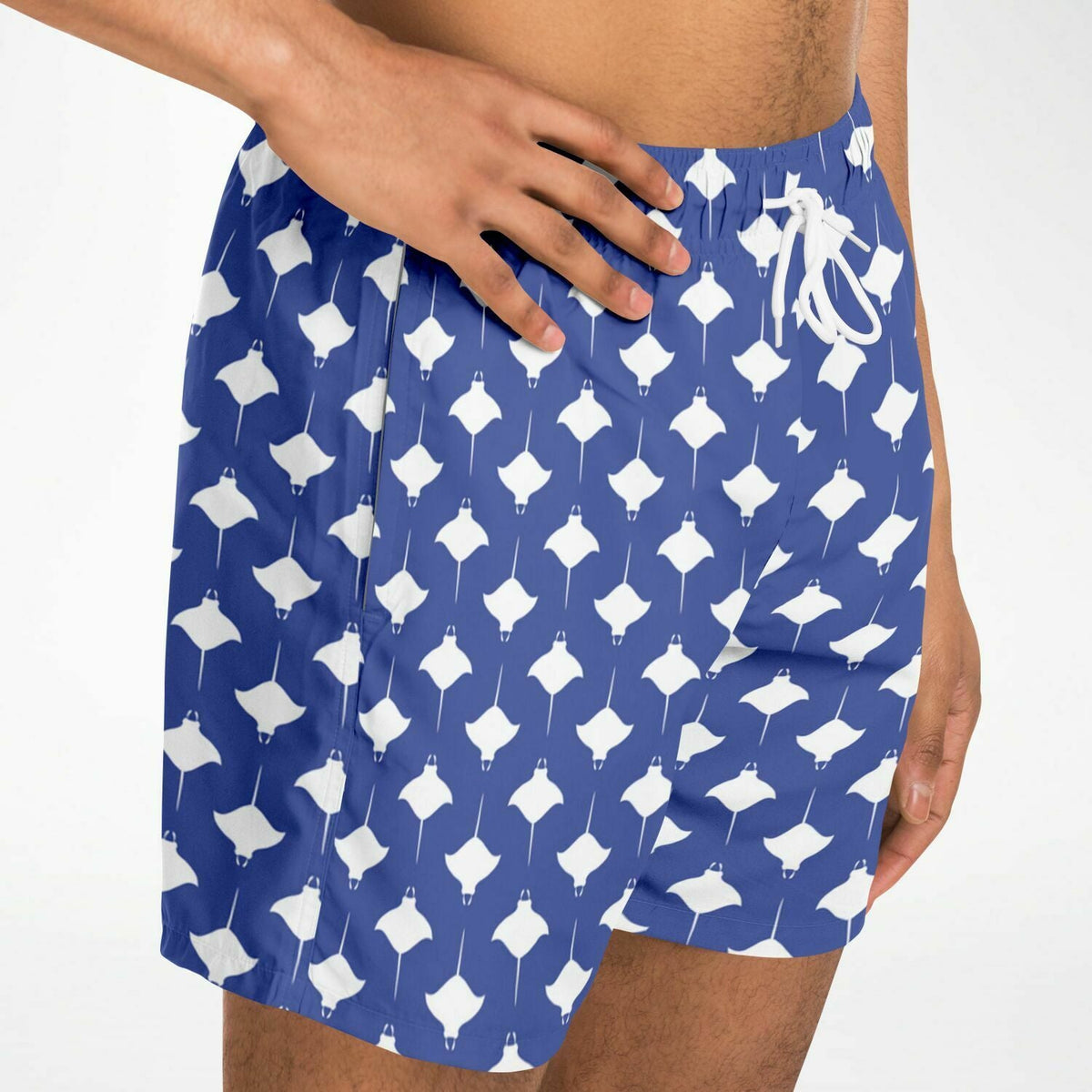 Men's swim shorts in blue with white manta ray pattern made by Maris Equi featuring an elastic waistband and drawstring.