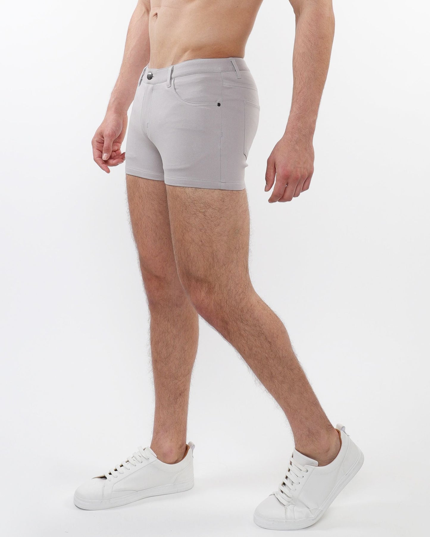 Light gray slim-fit 3 inch stretch knit shorts with classic five-pocket design and subtle stitching details