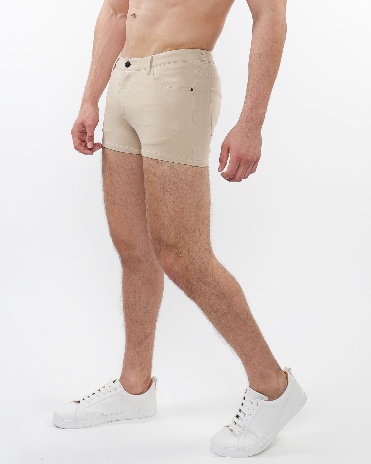 Beige 3 inch stretch knit chino shorts with classic five-pocket design and black button closure