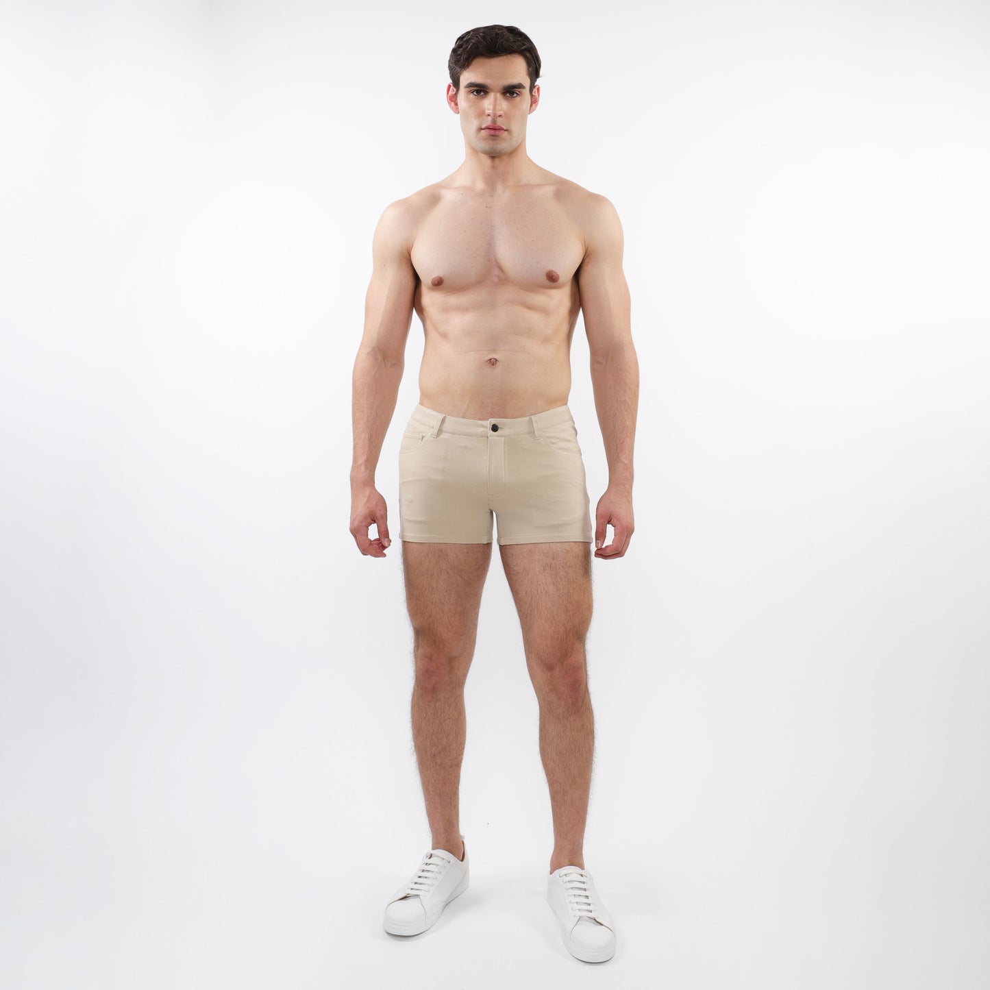 Beige 3 inch stretch knit chino shorts with classic button closure and tailored fit