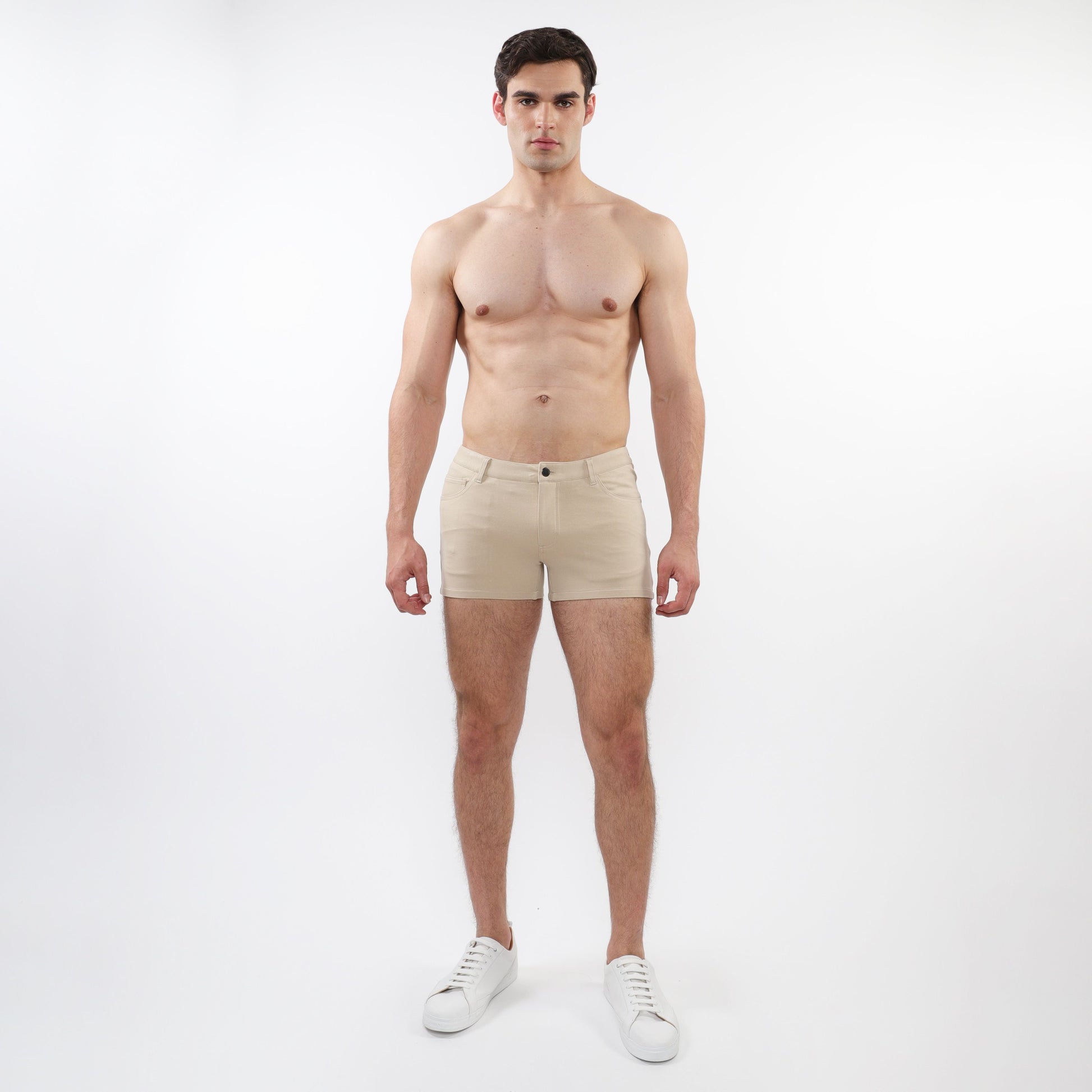 Beige 3 inch stretch knit chino shorts with classic button closure and tailored fit