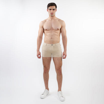 Beige 3 inch stretch knit chino shorts with classic button closure and tailored fit