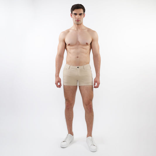 Beige 3 inch stretch knit chino shorts with classic button closure and tailored fit