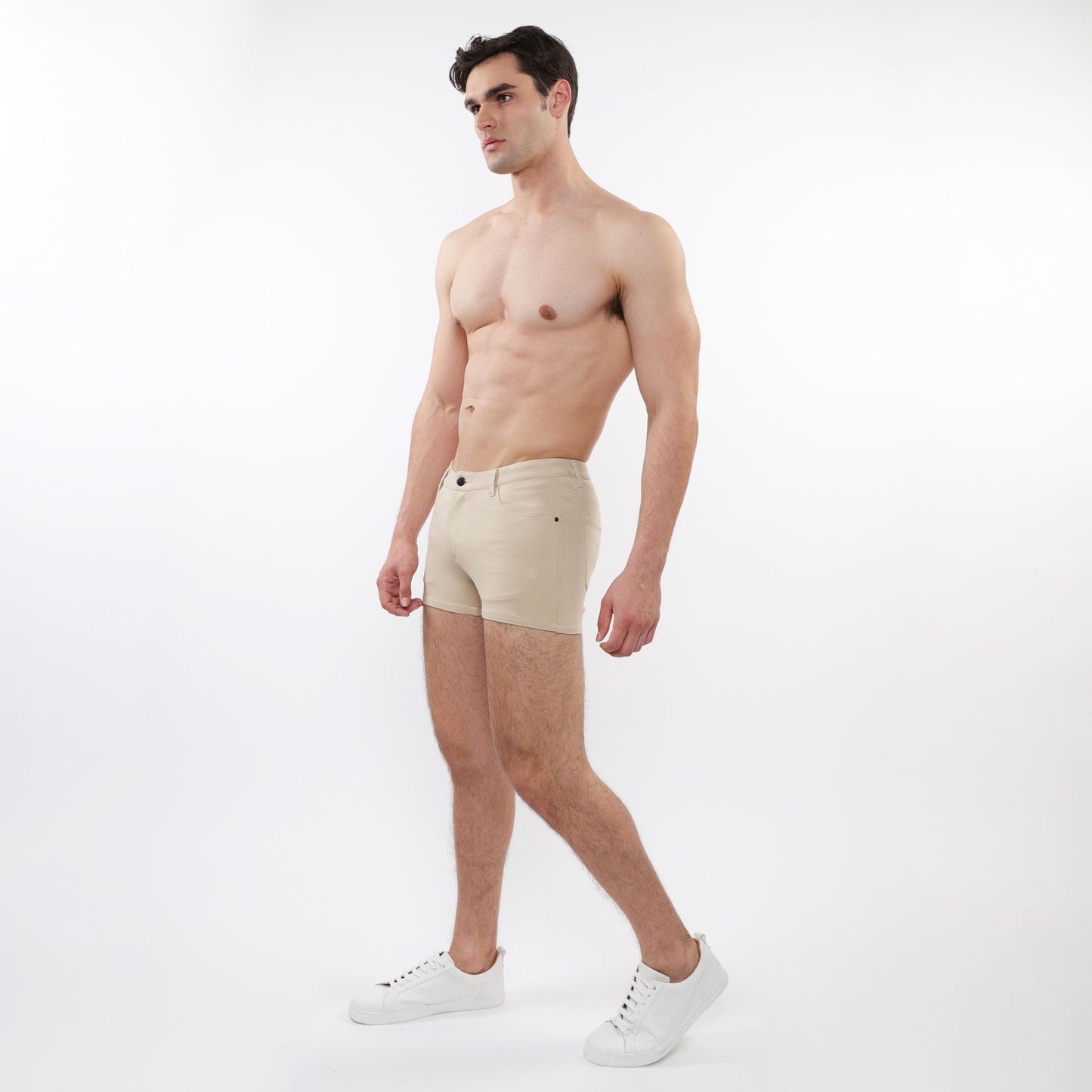 Beige 3 inch stretch knit short briefs with classic five pocket design and button closure in stretch fabric