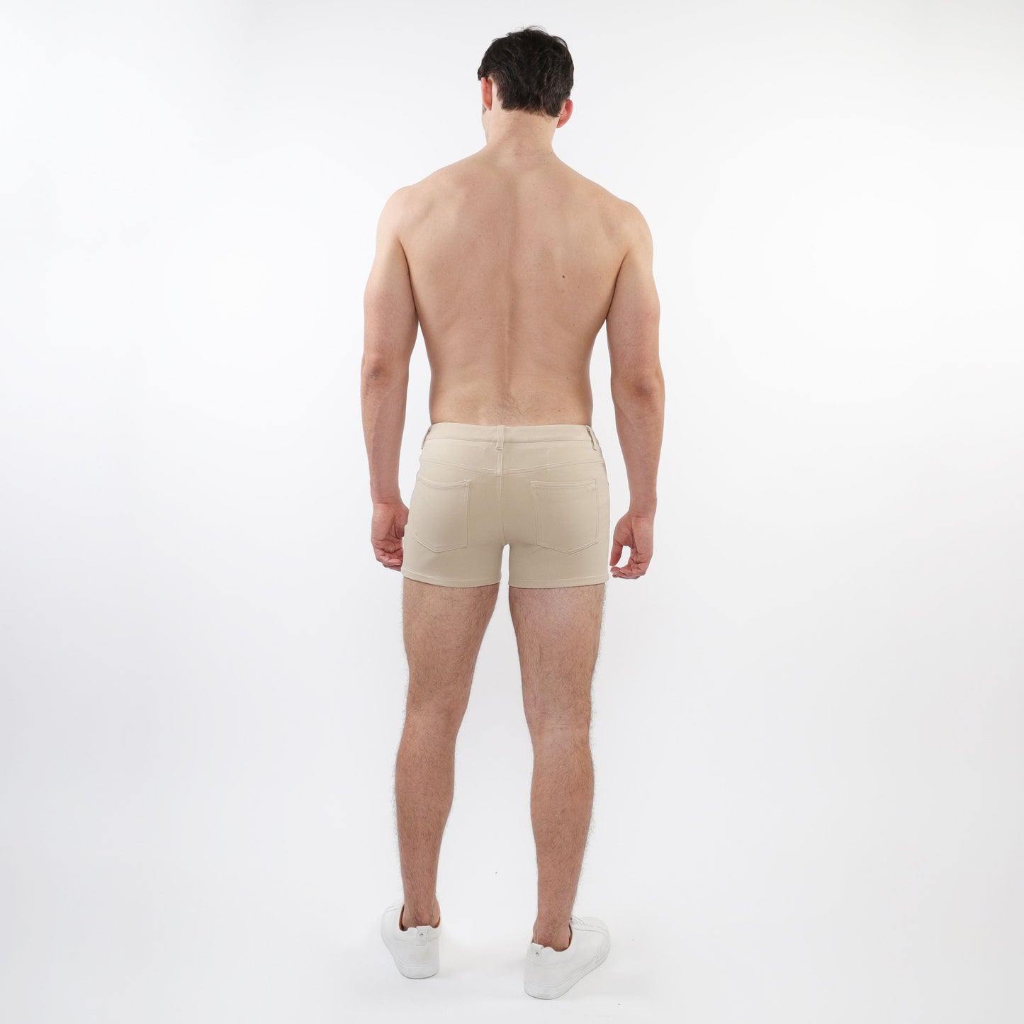 Beige 3 inch stretch knit short athletic briefs with sleek minimalist design and subtle stitching details