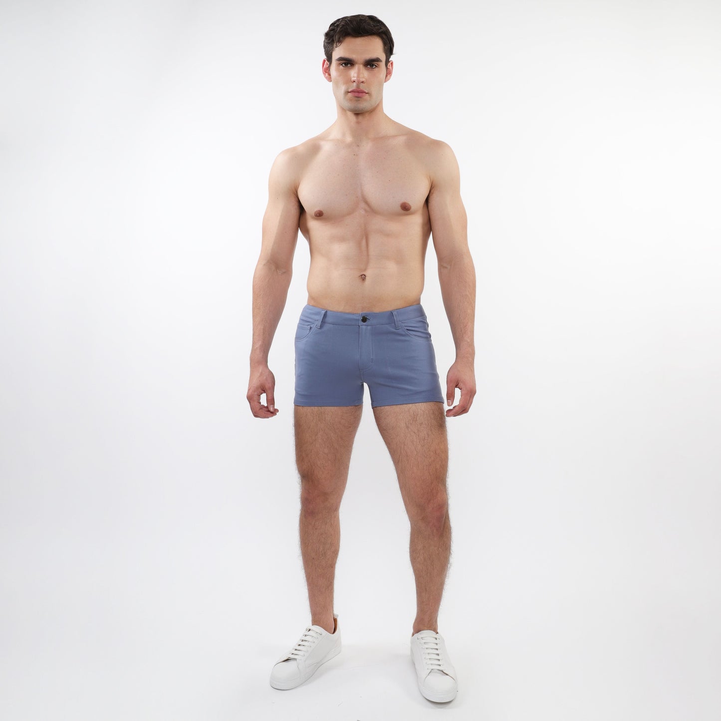 A pair of men’s light blue slim-fit 3 inch stretch knit shorts with five-pocket design and button closure