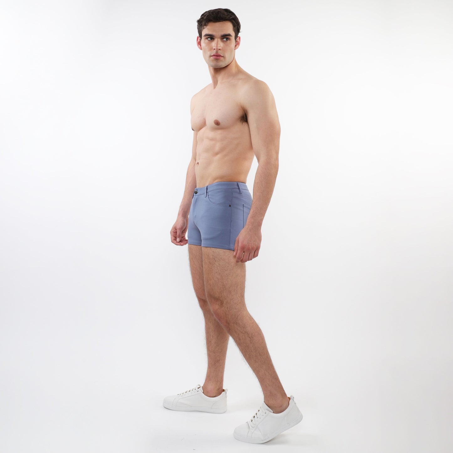 A pair of light blue 3 inch stretch knit shorts for men with tailored fit and subtle stitching details