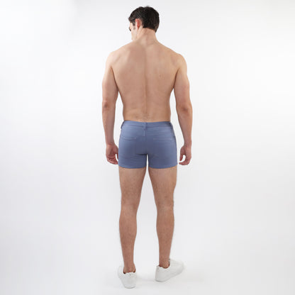 Blue denim 3 inch stretch knit shorts with classic fit and rear pockets shown from the back side