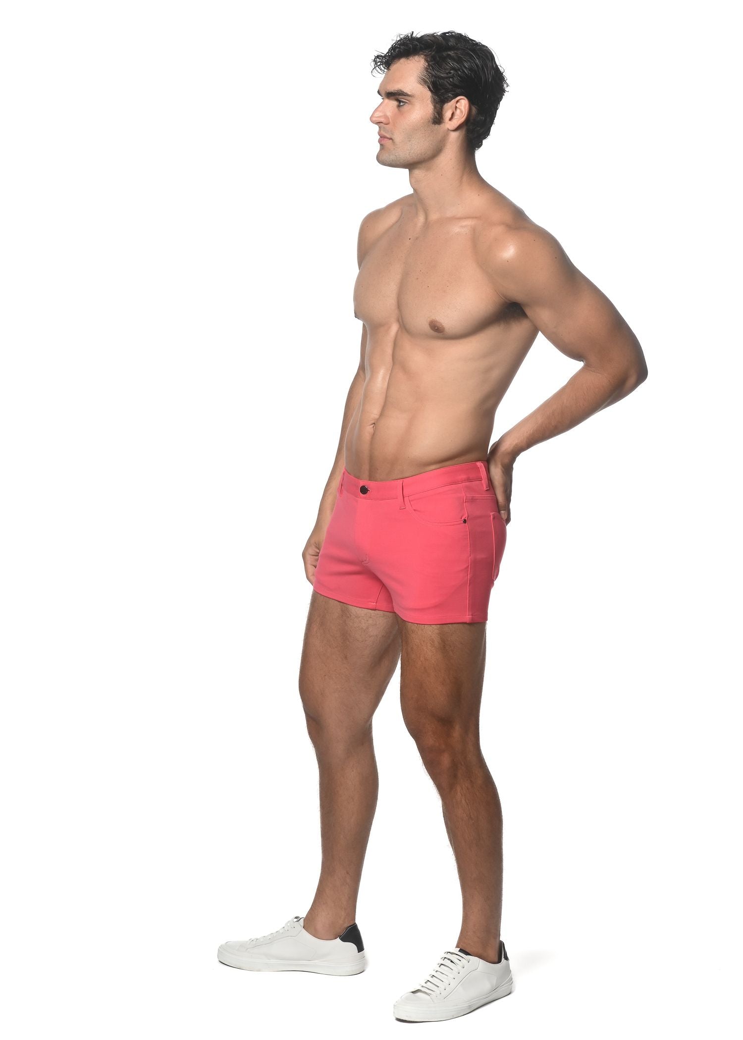 Bright pink 3 inch stretch knit shorts with classic five-pocket design and button closure for casual wear