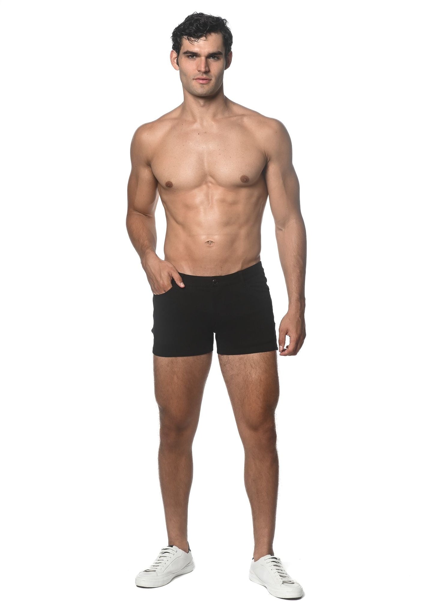Black 3 inch stretch knit athletic shorts made of breathable fabric worn by a model front view