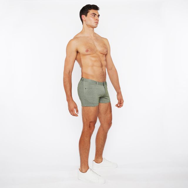 A pair of olive green slim-fit boxer shorts with stretch knit two-tone fabric and a modern textured design