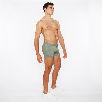 A pair of olive green slim-fit boxer shorts with stretch knit two-tone fabric and a modern textured design