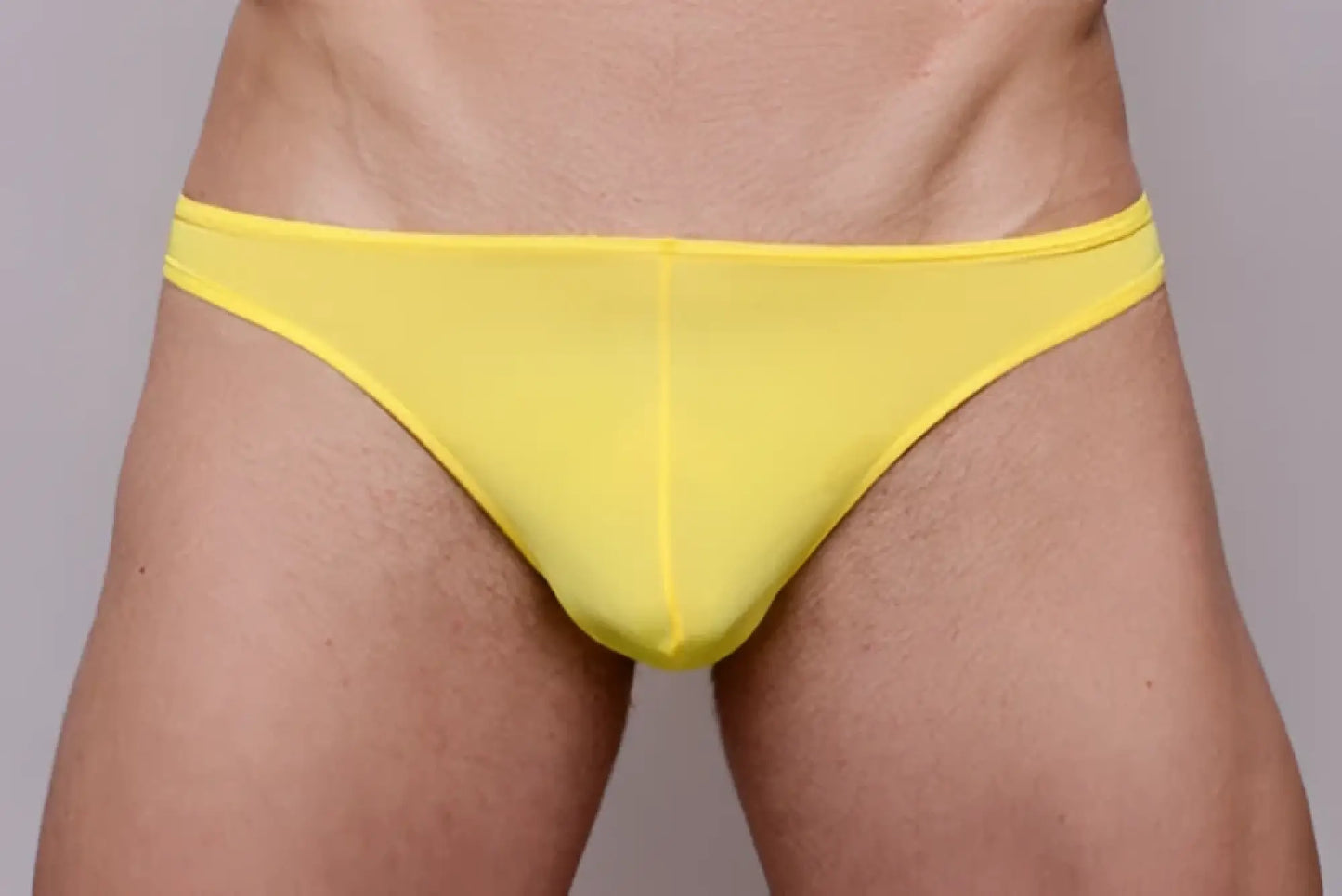 Bright yellow sheer mesh briefs shown from the back in a 3 pack pride metro thong set