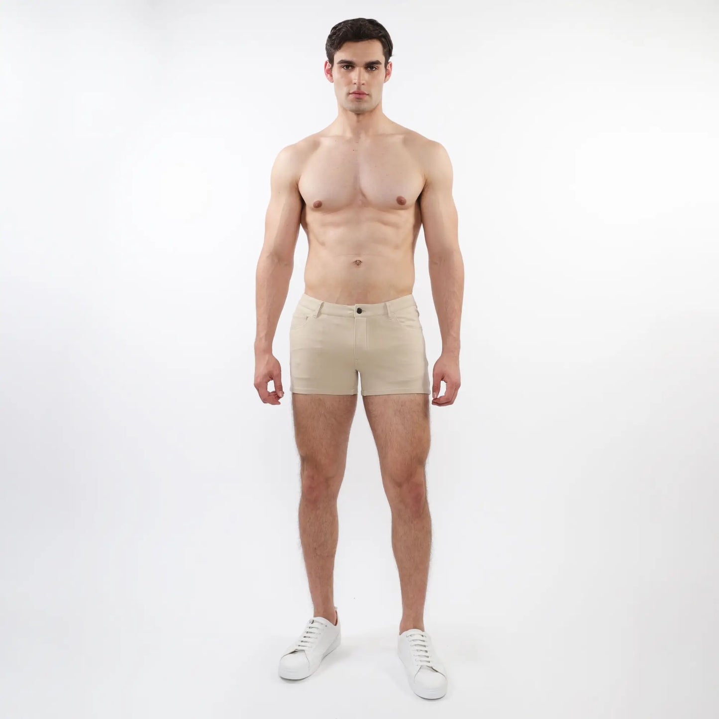 Beige 3 inch stretch knit chino shorts with classic button closure and tailored fit