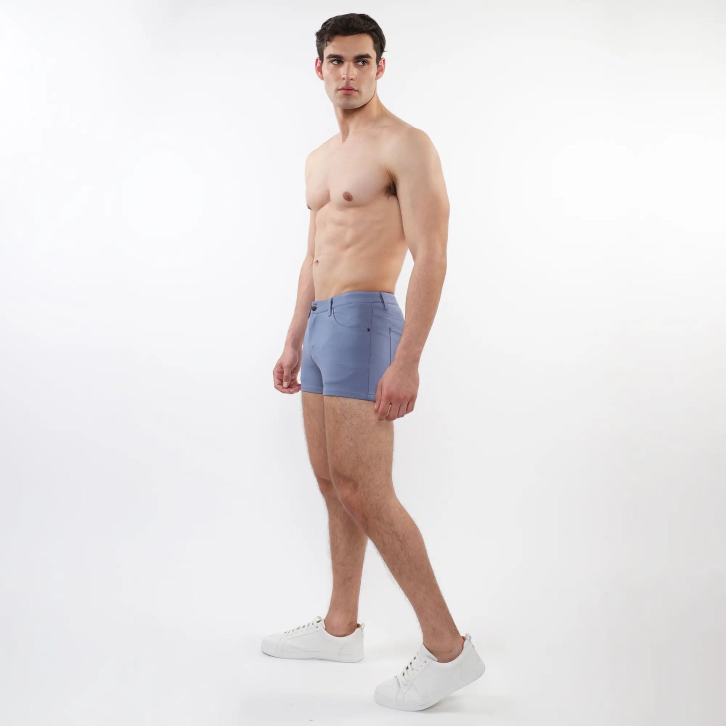 A pair of light blue 3 inch stretch knit shorts for men with tailored fit and subtle stitching details