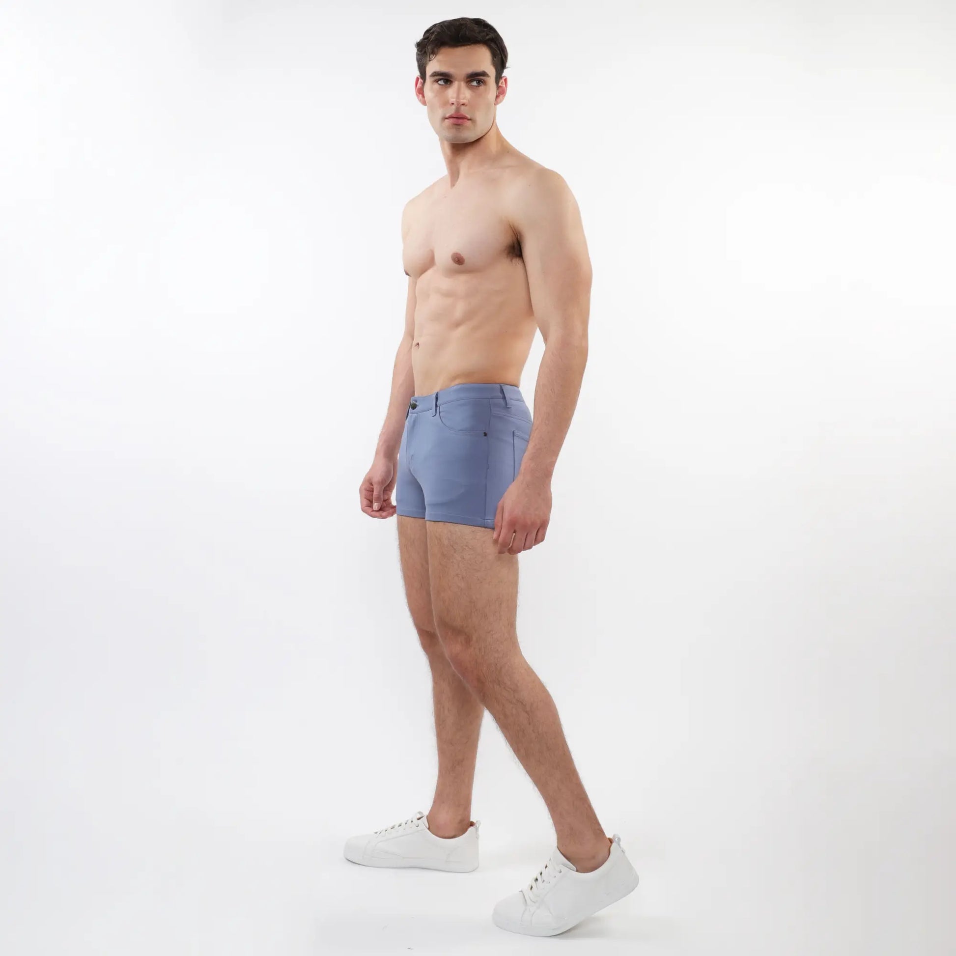 A pair of light blue 3 inch stretch knit shorts for men with tailored fit and subtle stitching details
